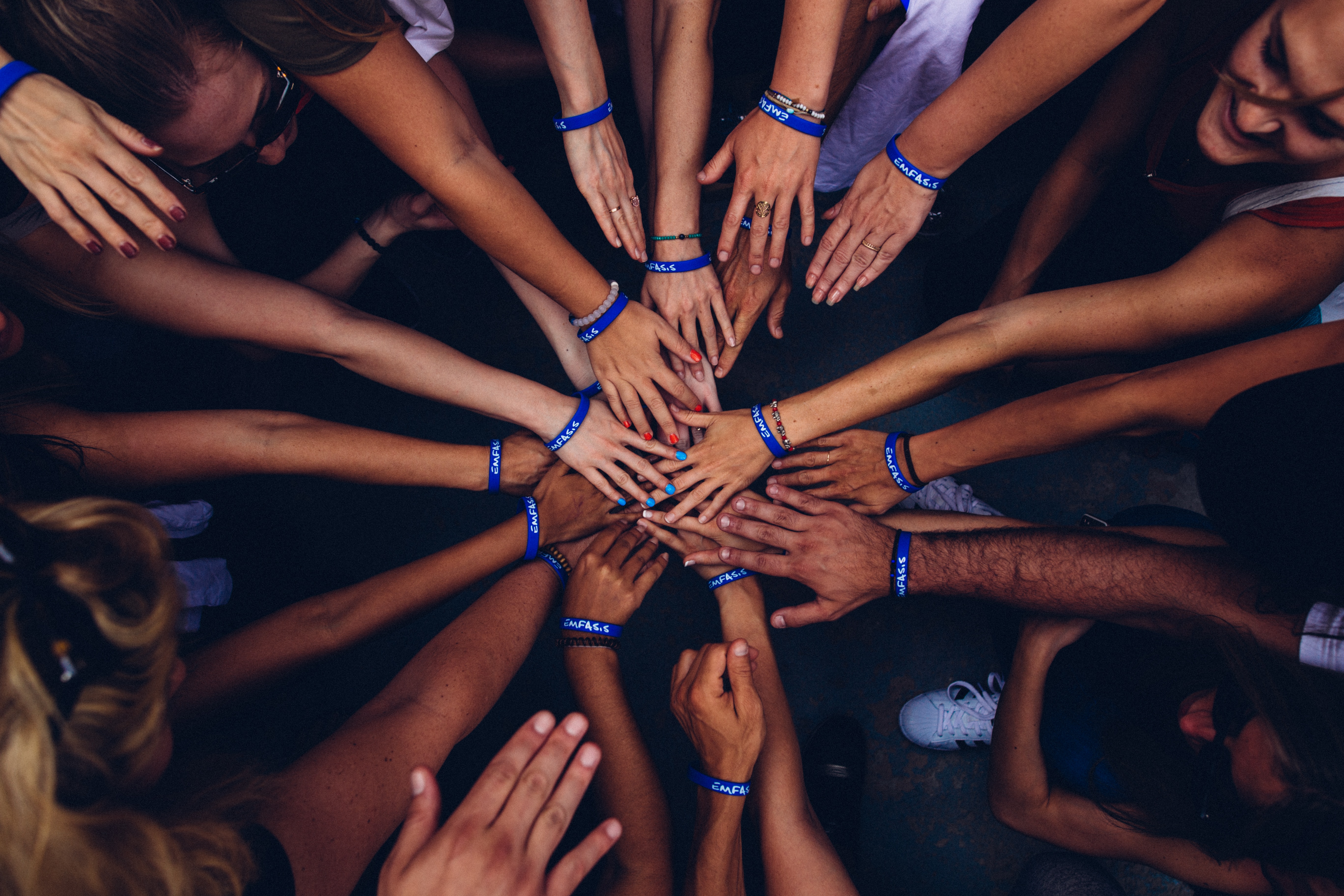 photo of volunteer hands in a circle